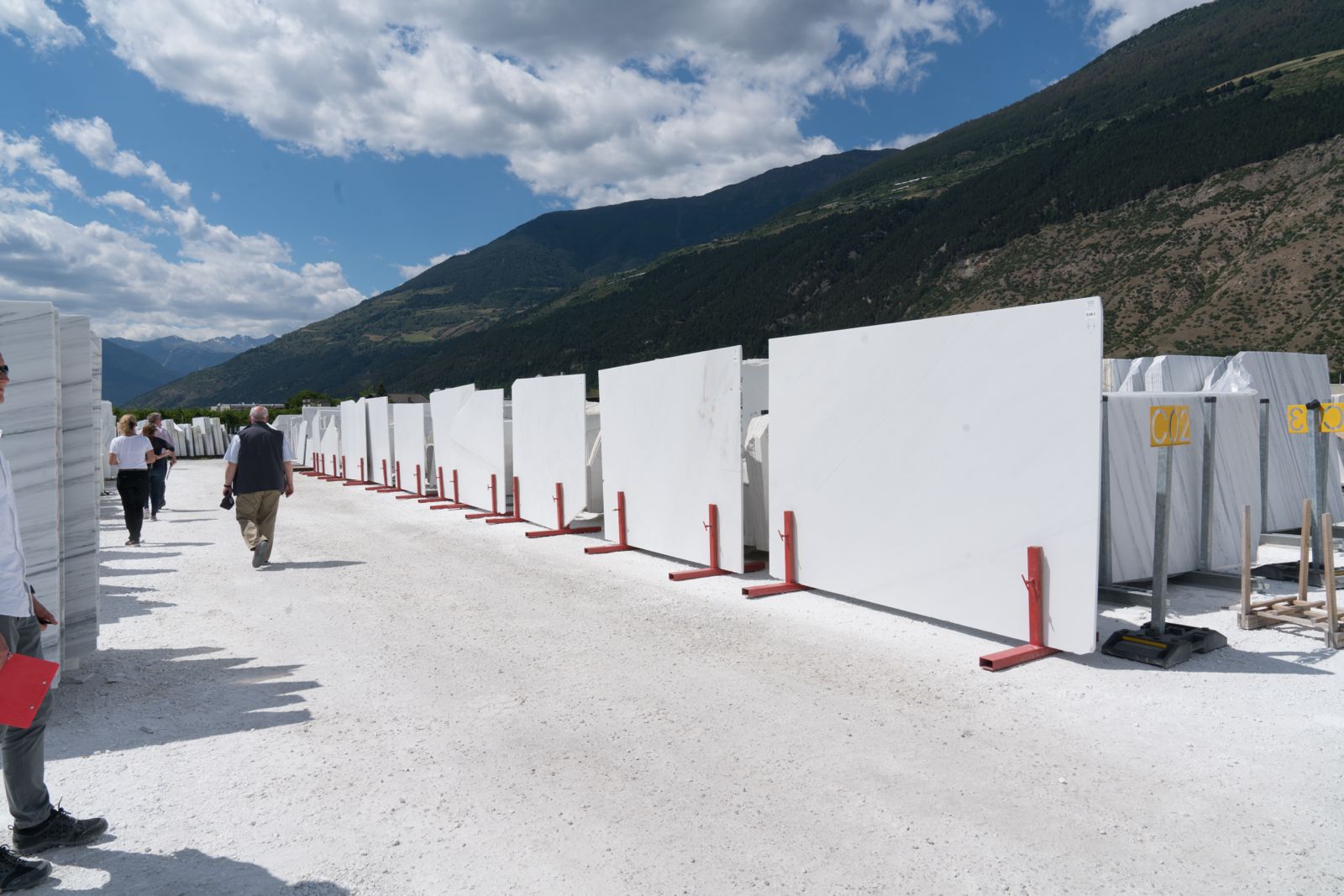 Manual range specification: natural stone slabs stood upright at the supplier for evaluation