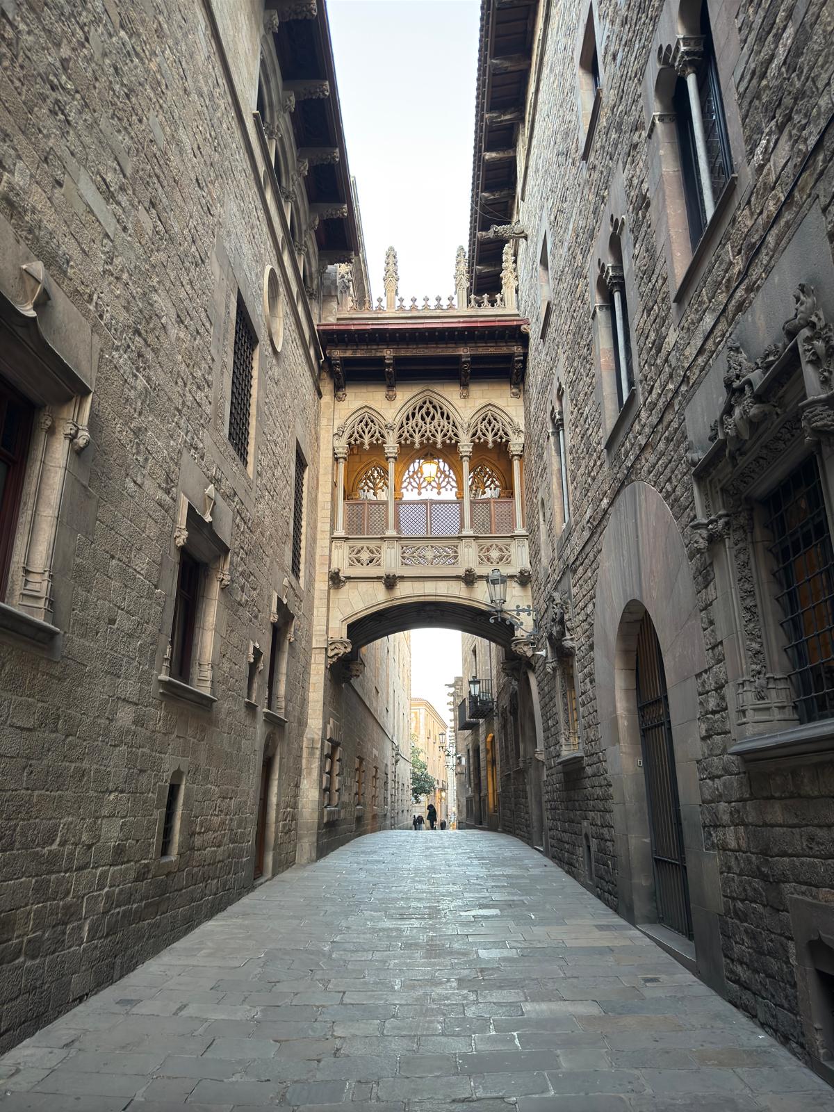 Gothic stone bridge in Barcelona with protected facade and minimal weathering